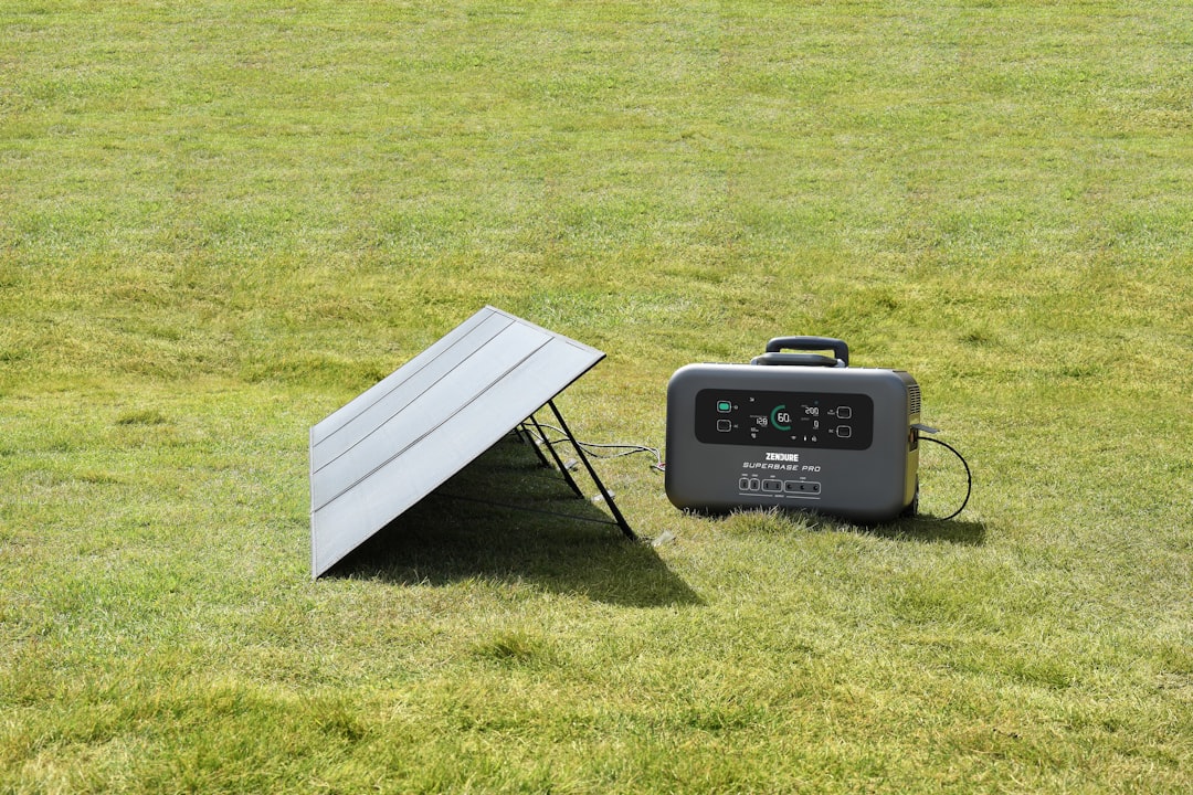 A professionally installed standby generator sitting on a concrete pad next to a residential home - whole home generator vs