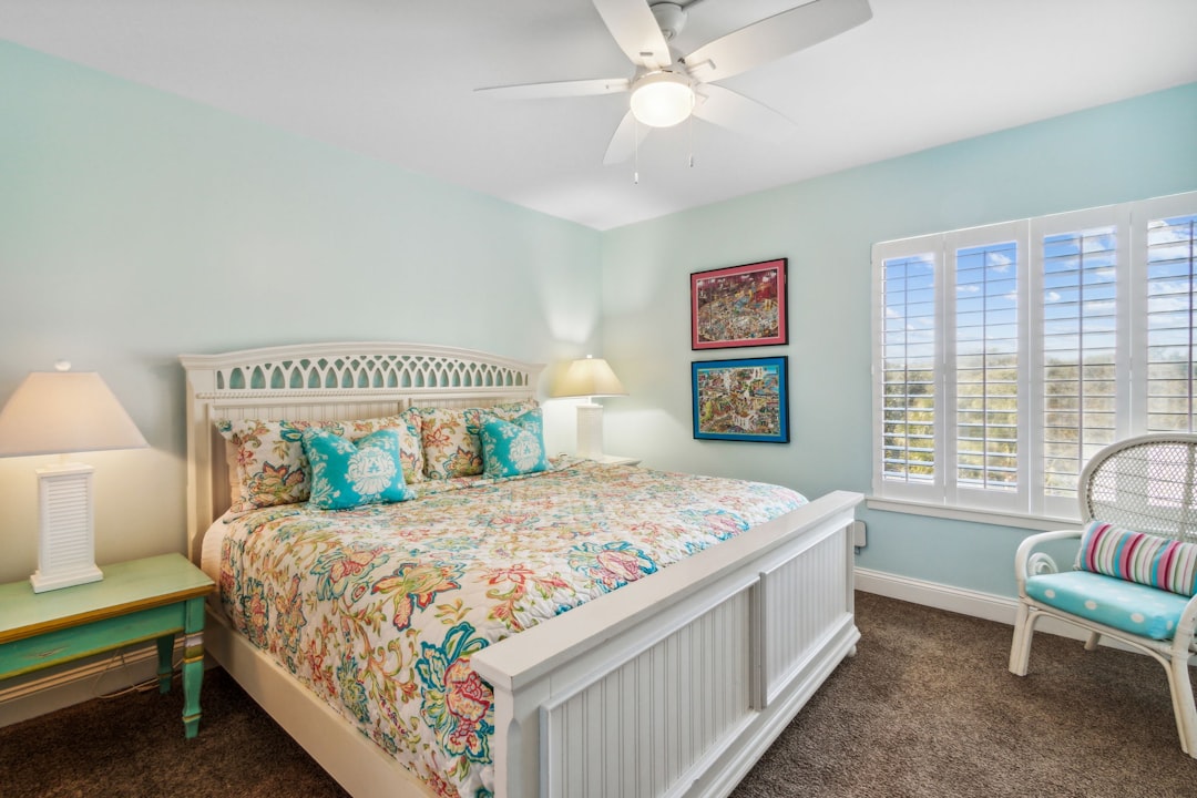 Ceiling fan in bright coastal living room with summer airflow Ceiling fan in bright coastal living room with summer airflow