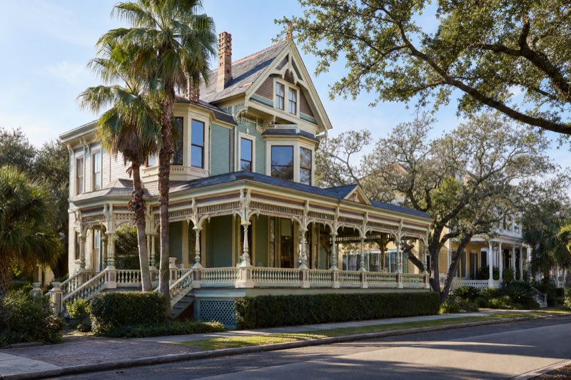 Ornate Victorian house with wrap-around porch in the Galveston East End historic district